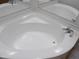 Clean corner bathtub with a simple design at 30138 W Roosevelt St, Buckeye, AZ 85396