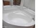 Clean corner bathtub with a simple design at 30138 W Roosevelt St, Buckeye, AZ 85396
