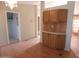 Bright dining area with wood cabinets and laminate flooring at 30138 W Roosevelt St, Buckeye, AZ 85396