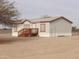 Mobile home with tree and gravel yard at 30138 W Roosevelt St, Buckeye, AZ 85396