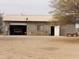 Detached garage with single door and large overhead door at 30138 W Roosevelt St, Buckeye, AZ 85396