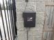 Automatic gate opener control box mounted on a block wall at 30138 W Roosevelt St, Buckeye, AZ 85396
