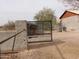 Black metal gate with automatic opener at 30138 W Roosevelt St, Buckeye, AZ 85396