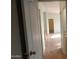 Hallway with light walls and wood-look flooring at 30138 W Roosevelt St, Buckeye, AZ 85396