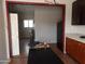 Kitchen with dark countertops, wood cabinets, and a view into another room at 30138 W Roosevelt St, Buckeye, AZ 85396
