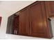 Dark wood kitchen cabinets with wine rack at 30138 W Roosevelt St, Buckeye, AZ 85396