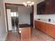 Bright kitchen features ample cabinetry, an island, and tile flooring at 30138 W Roosevelt St, Buckeye, AZ 85396