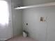 Laundry room with shelving and built-in utility sink at 30138 W Roosevelt St, Buckeye, AZ 85396