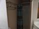 Shower stall with teal and brown patterned shower curtain at 30138 W Roosevelt St, Buckeye, AZ 85396