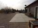 Side yard with gravel, a concrete patio, and trees at 30138 W Roosevelt St, Buckeye, AZ 85396