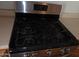 Stainless steel gas stove with five burners at 30138 W Roosevelt St, Buckeye, AZ 85396