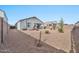 Spacious backyard with gravel and mature plants at 3111 N 309Th Dr, Buckeye, AZ 85396