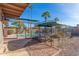 Relaxing pool area with large aviary and dog house at 3823 E Poinsettia Dr, Phoenix, AZ 85028