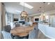 Open kitchen with island, light fixtures, and wood flooring at 4058 S Alamandas Way, Gold Canyon, AZ 85118