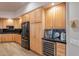 Modern kitchen with black appliances and ample wood cabinetry at 4058 S Alamandas Way, Gold Canyon, AZ 85118