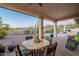 Covered patio with seating area and mountain views at 4058 S Alamandas Way, Gold Canyon, AZ 85118