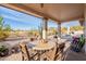 Covered patio with seating area and view of backyard at 4058 S Alamandas Way, Gold Canyon, AZ 85118