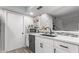 Modern kitchen with white cabinets, stainless steel dishwasher, and a black sink at 4413 E Pueblo E Ave, Phoenix, AZ 85040