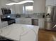 Modern kitchen with white cabinets and quartz countertops at 5210 W Jupiter N Way, Chandler, AZ 85226