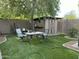 Backyard with artificial turf, shed, and patio table set at 5839 E Norwood St, Mesa, AZ 85215