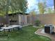 Landscaped backyard featuring a shed and AC unit at 5839 E Norwood St, Mesa, AZ 85215