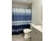 Clean bathroom, gray vanity, shower stall with curtain at 5839 E Norwood St, Mesa, AZ 85215