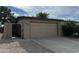 Tan colored garage with driveway and landscaping at 5839 E Norwood St, Mesa, AZ 85215