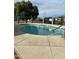 Community pool with surrounding patio at 5839 E Norwood St, Mesa, AZ 85215