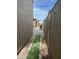 Side yard with gravel path and tall walls at 5839 E Norwood St, Mesa, AZ 85215