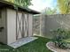 Beige storage shed with brown trim and a grassy yard at 5839 E Norwood St, Mesa, AZ 85215