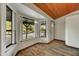 Living room with bay window and wood flooring at 6031 E Kohuana Pl, Cave Creek, AZ 85331