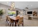 Bright dining area with wood table and access to backyard at 6530 E Libby St, Phoenix, AZ 85054