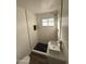 Stylish bathroom with a walk-in shower and hexagon tile at 7420 N 58Th Ave, Glendale, AZ 85301