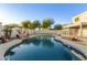 Stunning kidney shaped pool with a rock waterfall feature at 823 E Dragon Springs Dr, Casa Grande, AZ 85122