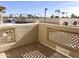 Private balcony with view of palm trees and buildings at 930 N Mesa Dr # 2034, Mesa, AZ 85201