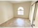 Bright bedroom with tile flooring and arched window at 930 N Mesa Dr # 2034, Mesa, AZ 85201