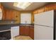 View of kitchen with ample wood cabinets and corner sink at 930 N Mesa Dr # 2034, Mesa, AZ 85201