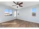 Bright bedroom with wood-look floors and a ceiling fan at 9814 E Palladium Dr, Mesa, AZ 85212