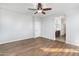 Spacious bedroom with wood-like flooring and a ceiling fan at 9814 E Palladium Dr, Mesa, AZ 85212