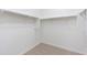 Spacious walk-in closet with double hanging rods at 9814 E Palladium Dr, Mesa, AZ 85212