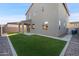 Two story home exterior with artificial turf at 9814 E Palladium Dr, Mesa, AZ 85212