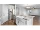 Modern kitchen with white cabinets, granite countertops, and stainless steel appliances at 9814 E Palladium Dr, Mesa, AZ 85212