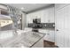 Modern kitchen with white cabinets, granite counters, and stainless steel appliances at 9814 E Palladium Dr, Mesa, AZ 85212