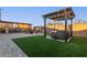 Relaxing hot tub with pergola cover in a grassy backyard at 10220 E Thatcher Ave, Mesa, AZ 85212