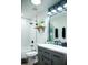 Updated bathroom features a vanity with double sinks and a large mirror at 10601 N 26Th Pl, Phoenix, AZ 85028