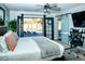Main bedroom with king bed, sliding barn door, and backyard access at 10601 N 26Th Pl, Phoenix, AZ 85028