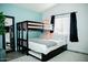 Bedroom with bunk beds and full-size bed, offering versatile sleeping arrangements at 10601 N 26Th Pl, Phoenix, AZ 85028