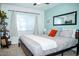 Bright bedroom with king bed, large window, and built-in shelving at 10601 N 26Th Pl, Phoenix, AZ 85028