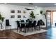 Modern dining room with a large table and fireplace at 10601 N 26Th Pl, Phoenix, AZ 85028