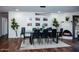 Modern dining room with a large table and fireplace at 10601 N 26Th Pl, Phoenix, AZ 85028